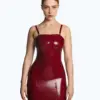 Close-up view of the intricate lace-up back detail on the red latex dress